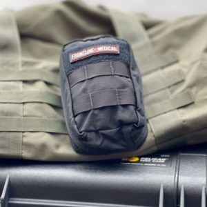black trauma solo first aid kit on molle