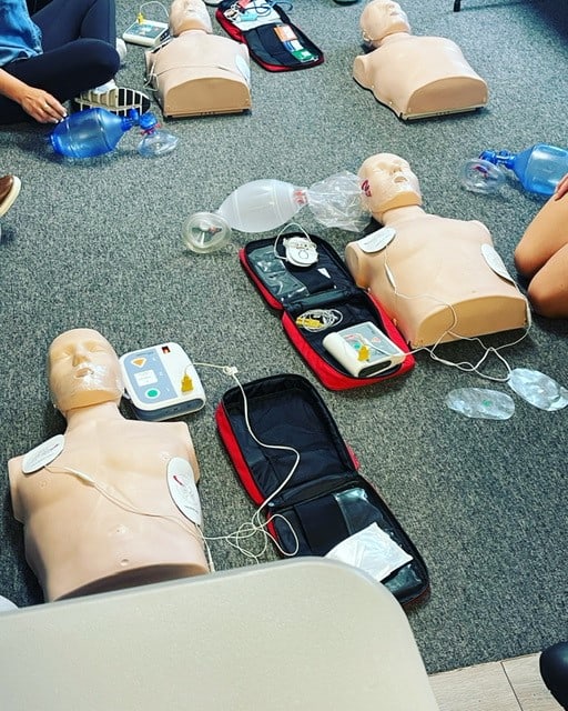 CPR training on the floor, AED application